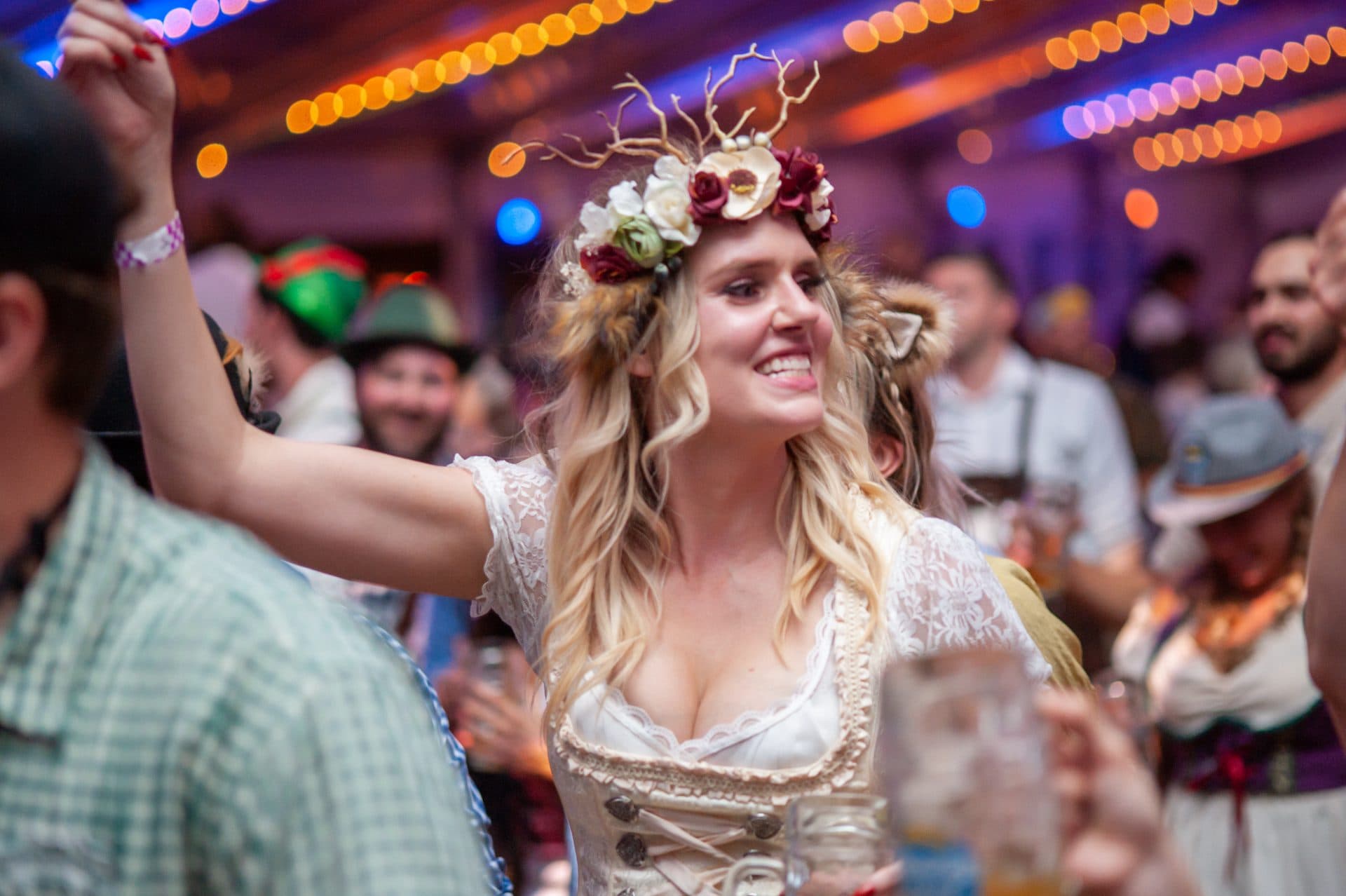 Woman in dirndl enjoys Oktoberfest party